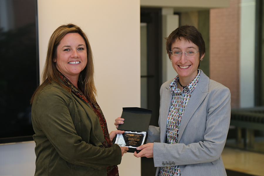 Chloe Arson receives her award from Interim School Chair Kimberly Kurtis. (Photo: Jess Hunt-Ralston)