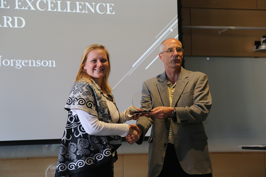 Marjorie Jorgenson receives her award from Ted Russell