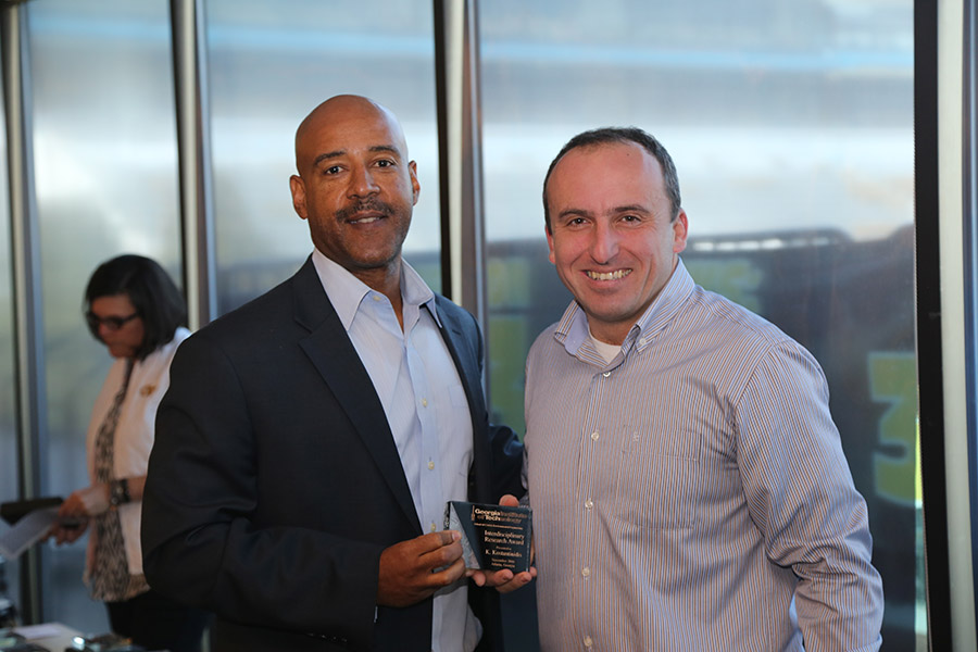 Kostas Konstantinidis receives his award from School Chair Reginald DesRoches. (Photo: Jess Hunt-Ralston)