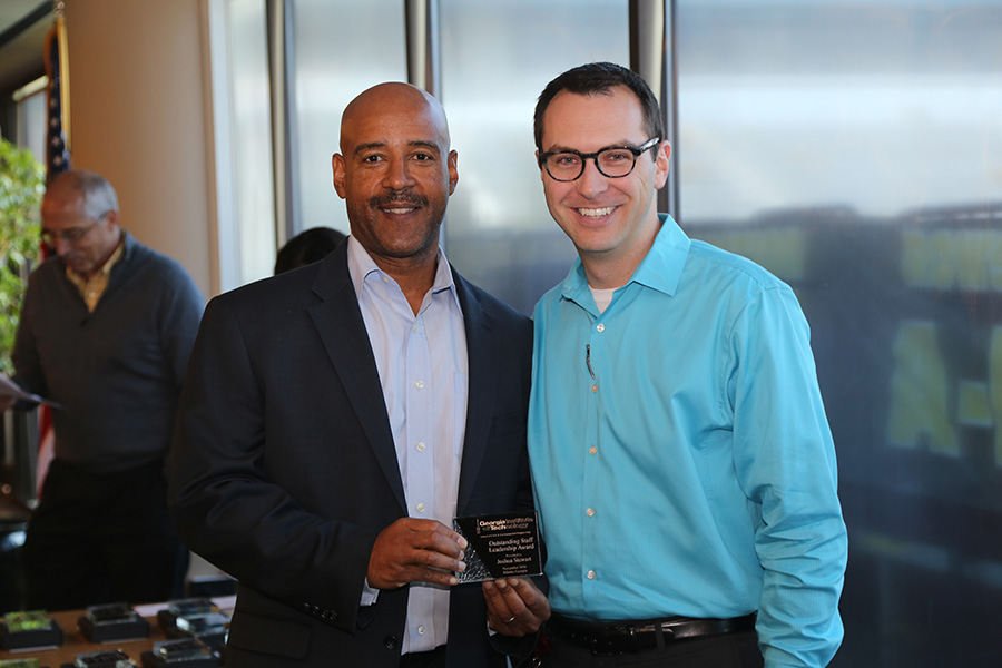 Joshua Stewart receives his award from School Chair Reginald DesRoches. (Photo: Jess Hunt-Ralston)