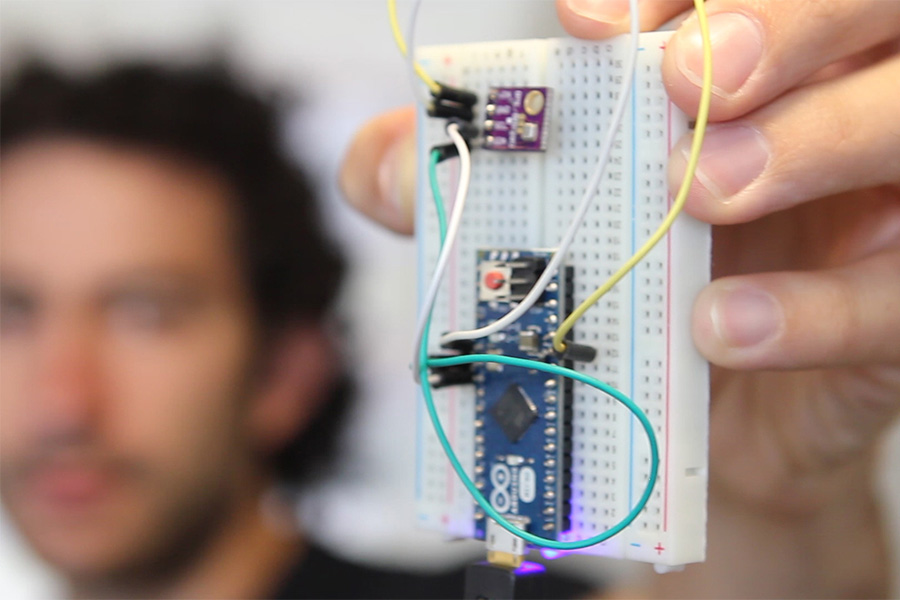 Georgia Tech Ph.D. student Simon Berrebi holds a barometric pressure sensor that measures elevation and pinpoints a streetcar in real-time. (Photo: Alyson Powell)