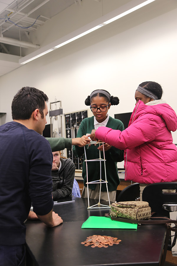 Their other engineering challenge was to build a tower using only drinking straws that was strong enough to hold a golf ball for at least five seconds. Students build a spot to hold their golf ball atop their tower.