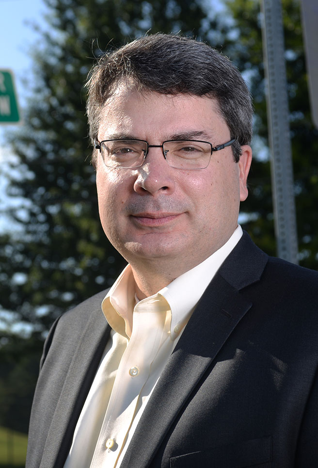 Associate Professor Michael Hunter, who has been promoted to full professor starting in the fall. (Photo: Chris Moore)