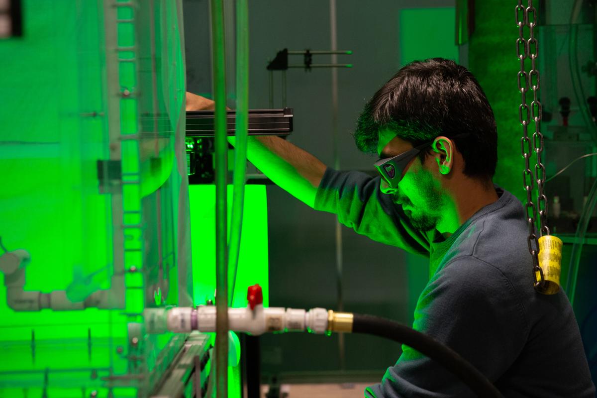 A student researcher checks the velocimetry setup