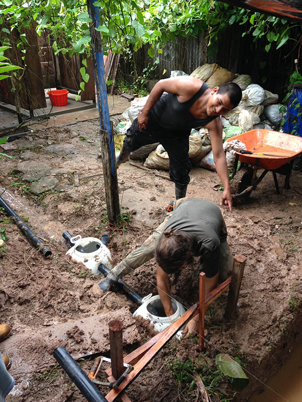 Eichbauer places the primary treatment tanks and piping for the system. (Photo Courtesy: Kelsey Eichbauer)