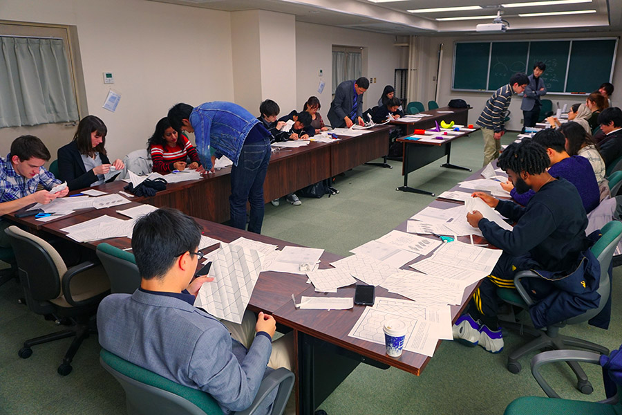 Students from Georgia Tech learn about the origins of some origami patterns from University of Tokyo Professor Tomohiro Tachi and his students. (Photo Courtesy: Larissa Novelino)