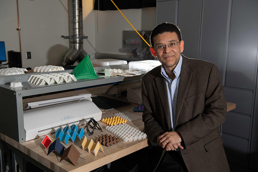 Raymond Allen Jones Chair Glaucio Paulino in his lab with examples of some of the origami designs he has developed. (Photo: Allison Carter)