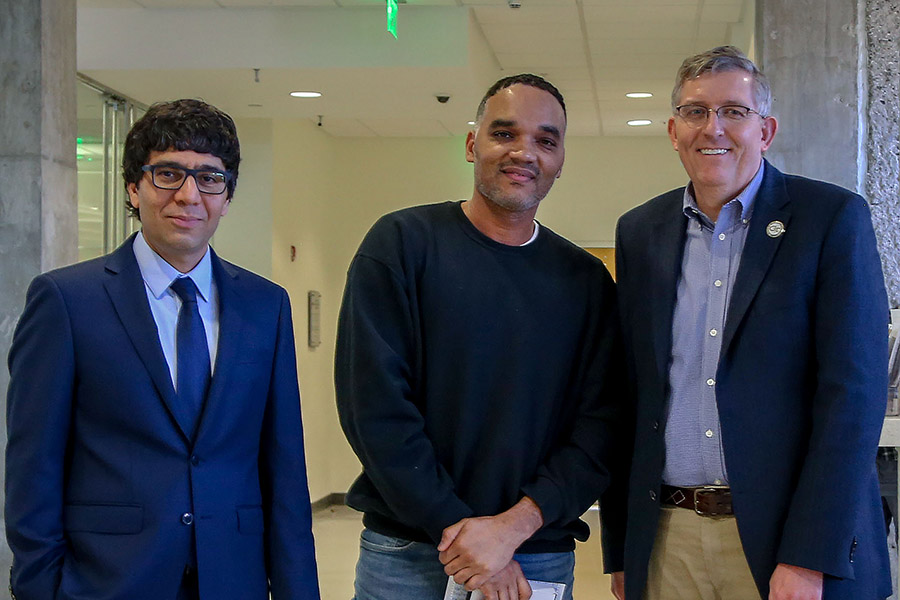 Billy Plum, center, receives his award from awards committee chair Arash Yavari, left, and School Chair Donald Webster.  (Photo: Amelia Neumeister)