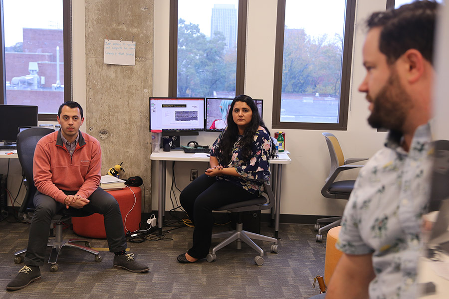 School of Civil and Environmental Engineering undergraduate Santiago Escobar, left, and Swinerton's Roya Agharahim listen as Matt Vanture from Whiting-Turner discusses final details of the team's plan for using robots to improve construction of canopies at the Atlanta airport. (Photos: Joshua Stewart)