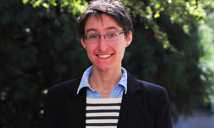 A portrait of Associate Professor Chloe Arson with trees in the background