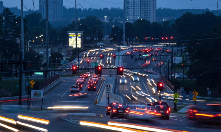 Traffic moves through the interchange at Ashford-Dunwoody Road and Interstate 285 in Atlanta's Perimeter area. The busy district is one of several areas where the Georgia Department of Transportation and some School of Civil and Environmental Engineering alumni at Kimley-Horn and Associates are using advanced technology and traffic signal timing to maximize the flow of traffic. (Photo Courtesy: Kimley-Horn and Associates)