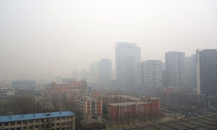 Air pollution hangs over a portion of Beijing, China. A new study by researchers from Georgia Tech, the University of Minnesota, Yale University and partners in China finds that cities could cut greenhouse gas emissions by a third, significantly improving air quality and health, by adopting a series of strategies to reuse industrial waste. (Photo Courtesy: Humphrey School of Public Affairs, University of Minnesota)