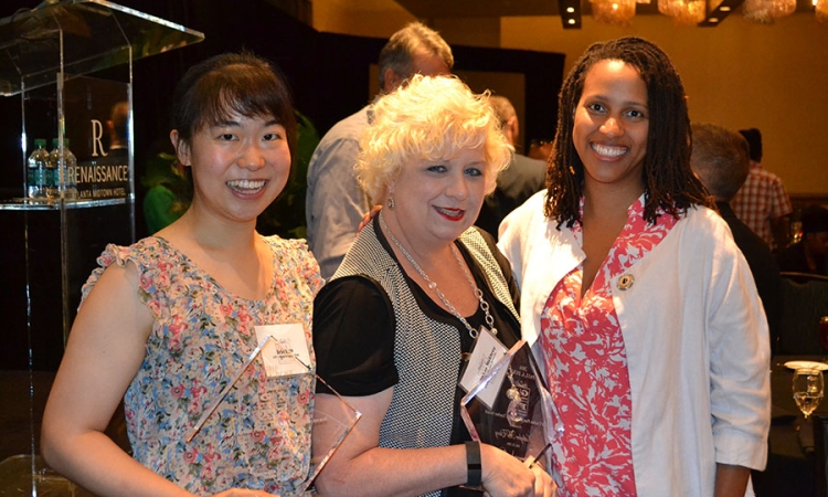 Iris Tien, left, with Gwinnett County middle school teacher Kathylee McElroy and Jamila Cola after Tien and McElroy won awards for their collaboration on engineering lesson plans for McElroy's science classes. They've been working together for two years through a program made possible by the National Science Foundation Partnerships for Research, Innovation, and Multi-Scale Engineering. Cola is the director of that program. (Photo Courtesy: Iris Tien)