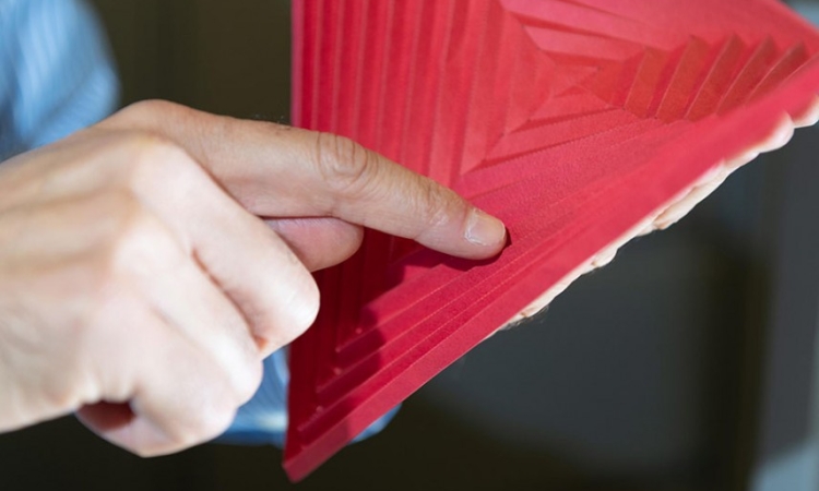 Glaucio Paulino, a professor in the Georgia Tech School of Civil and Environmental Engineering, demonstrates hyperbolic paraboloid origami 