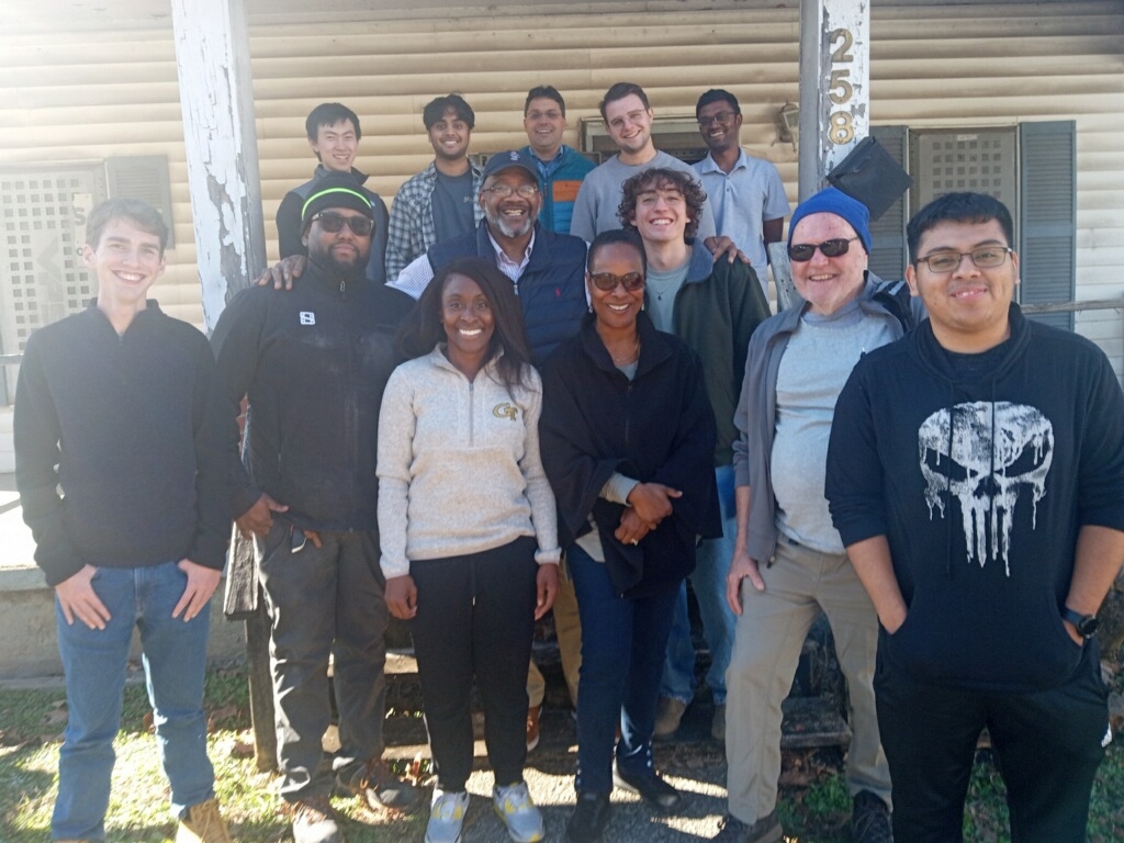 The team visits the site of the house they plan to build in Vine City.