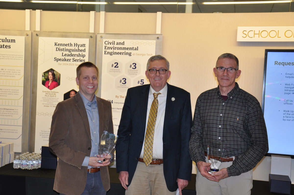 Professor Ryan Sherman, left, with Chair Don Webster and Professor Fred Meyer