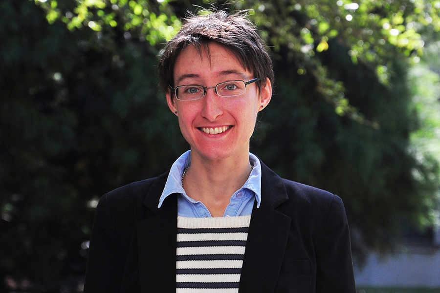 A portrait of Associate Professor Chloe Arson with trees in the background